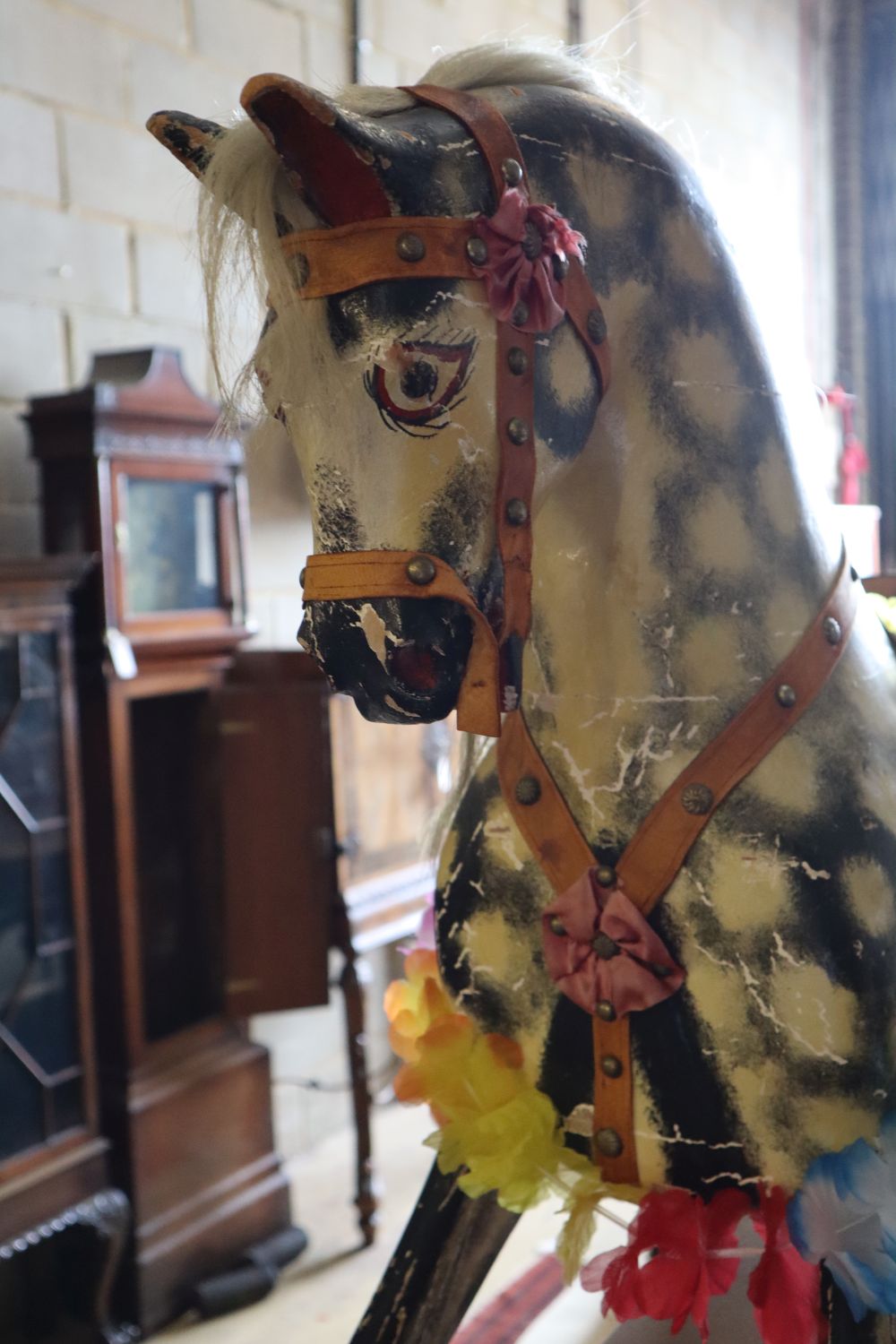 An Ayres-type rocking horse on wooden frame, length 130cm height 108cm (a.f.)